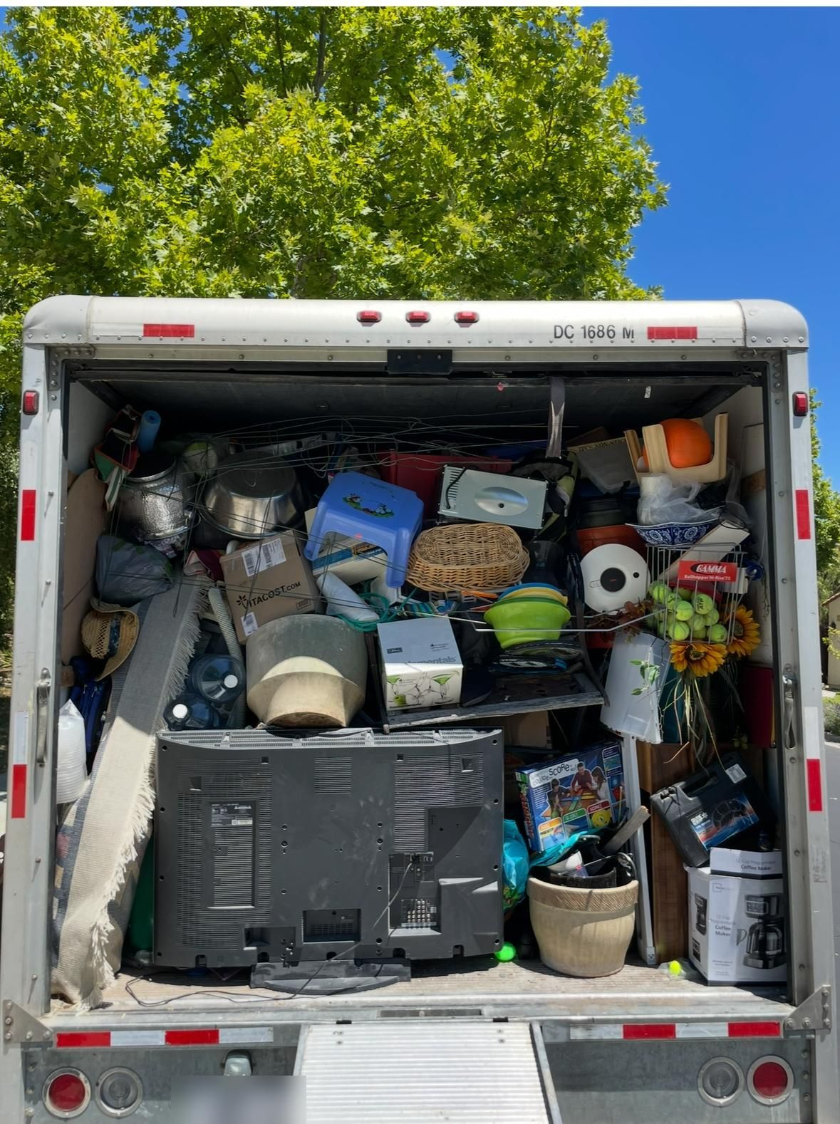Box truck loaded with household items from a cleanout