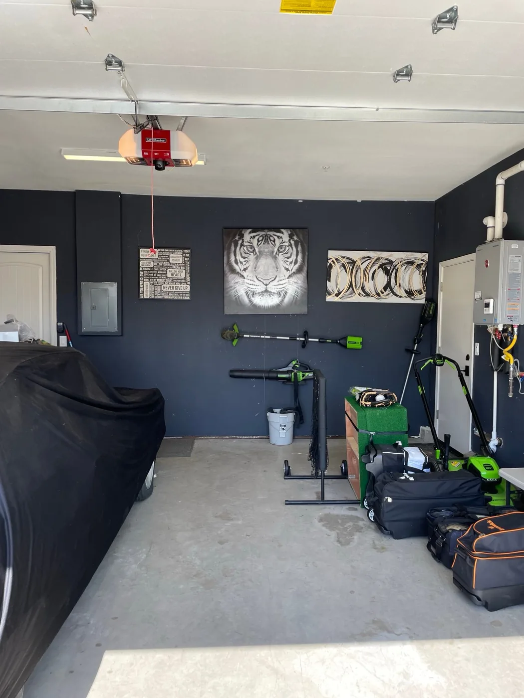 Garage after a cleanout with the floor cleared and tools organized