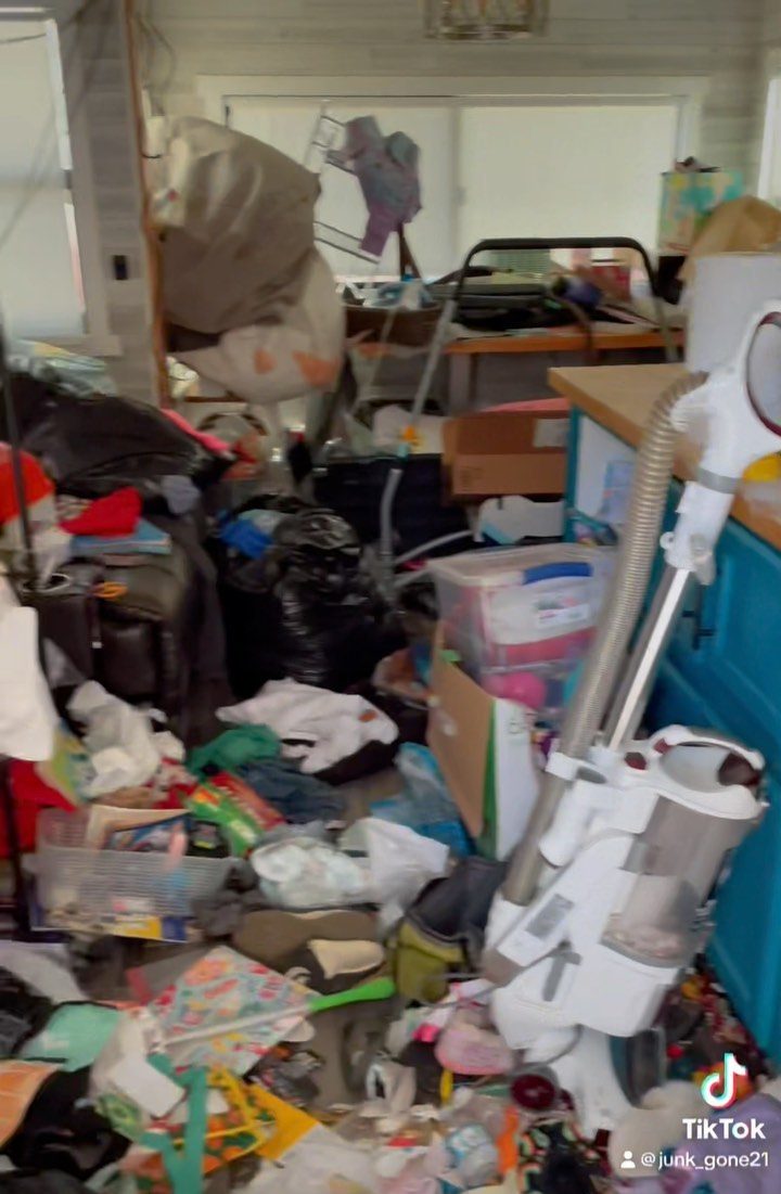Room filled with belongings before a hoarder cleanout