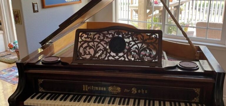 Antique upright piano before removal